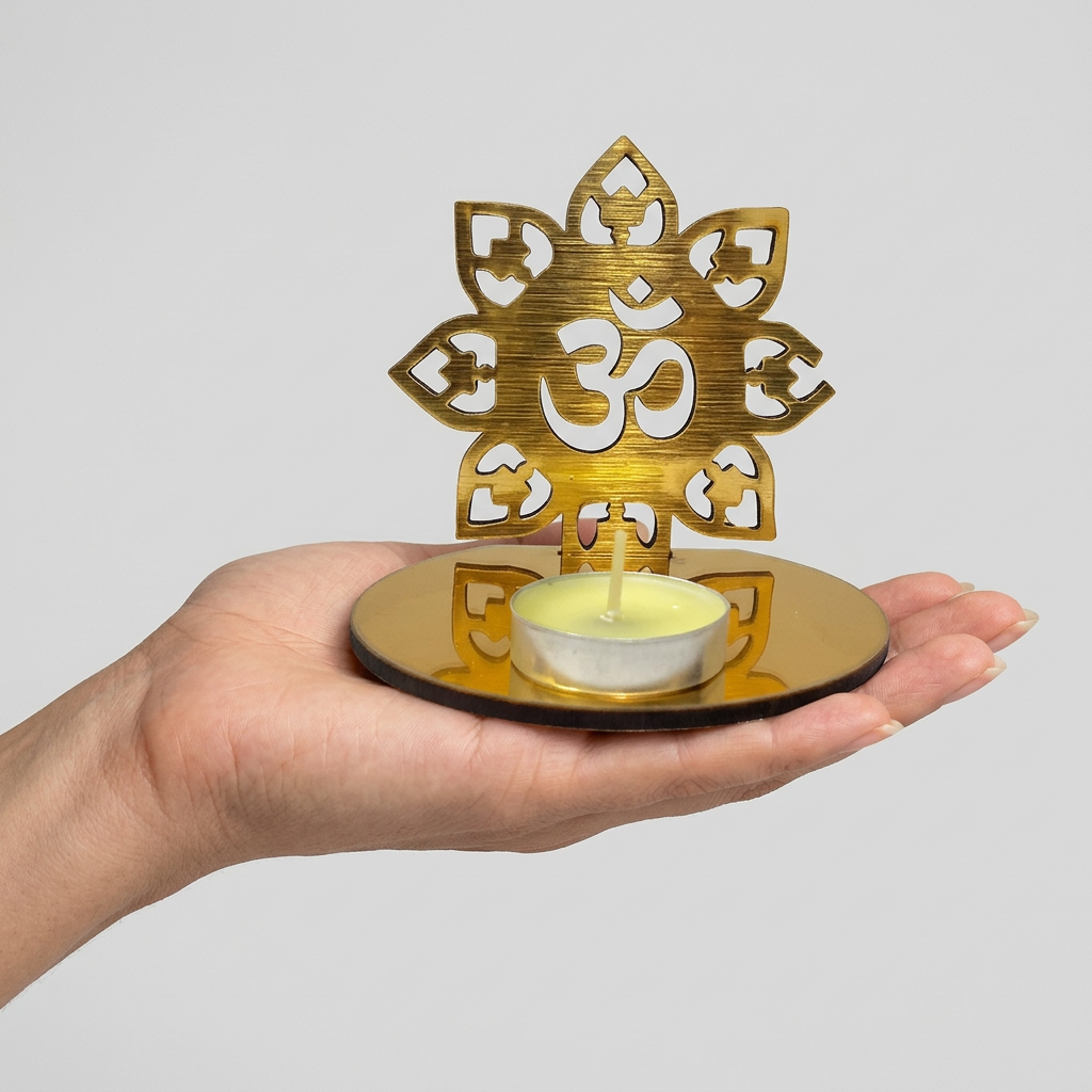 Hand holding the golden Om tealight holder